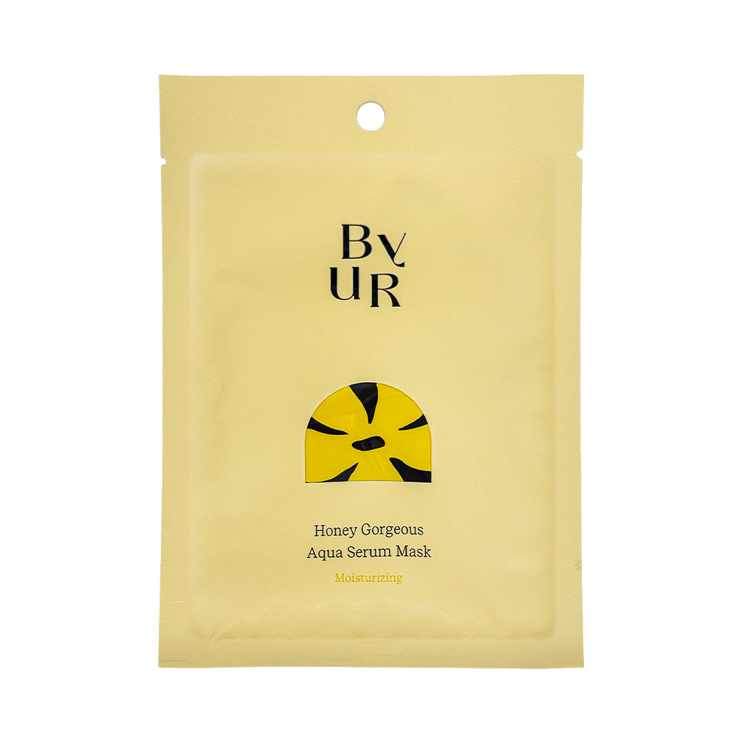 Front of a yellow BYUR sheet mask packaging with text and branding.